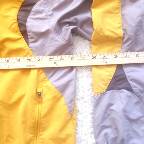 The North Face Flight SerieYellow and Gray Windbreaker.